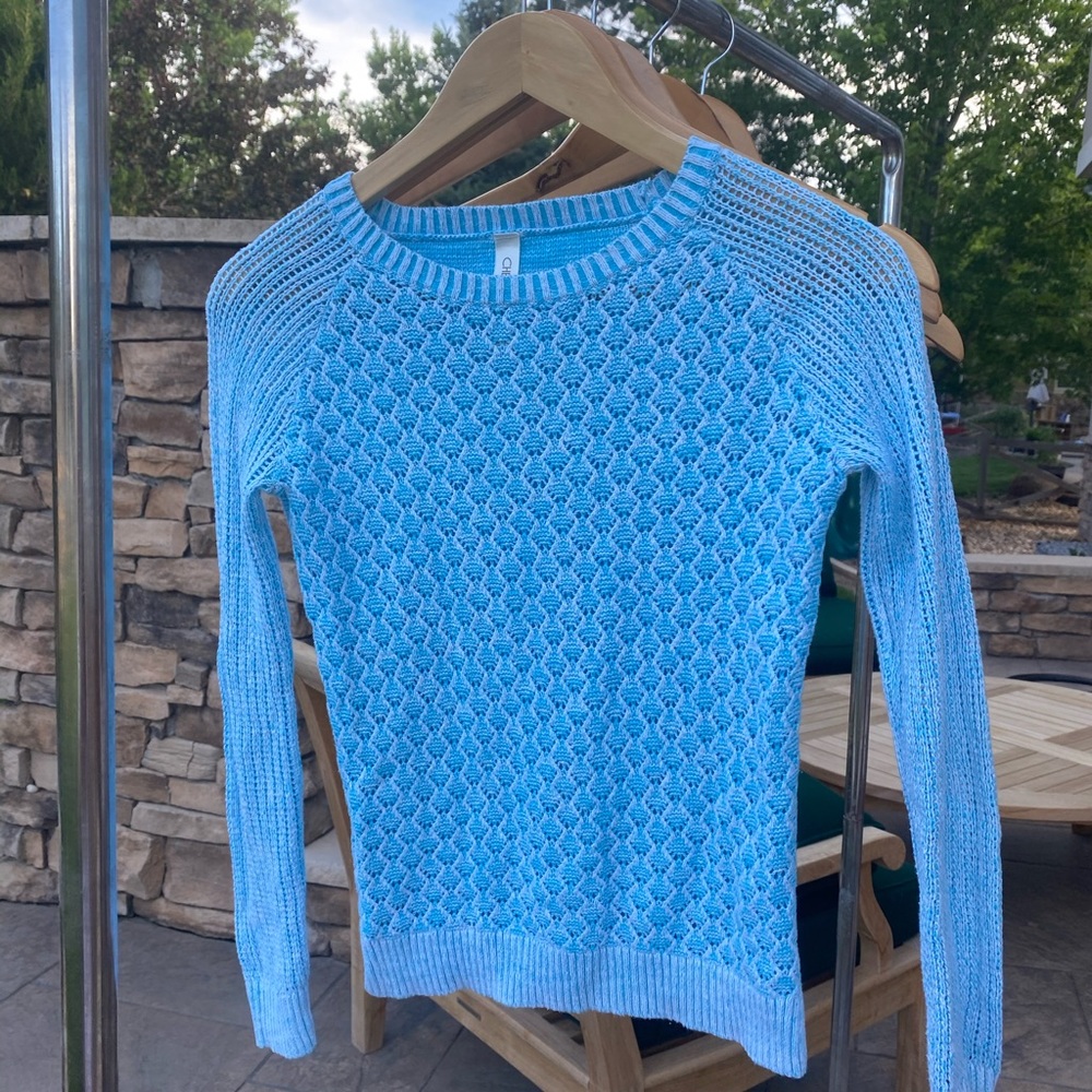 Girl’s blue sweater